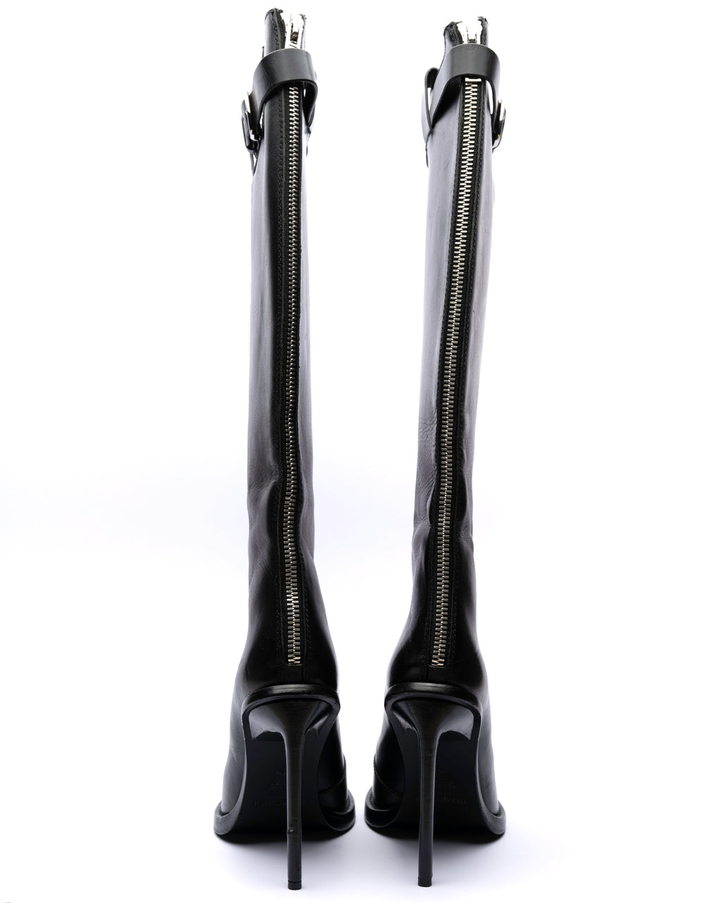 Black knee-high boots with zippers on a white background