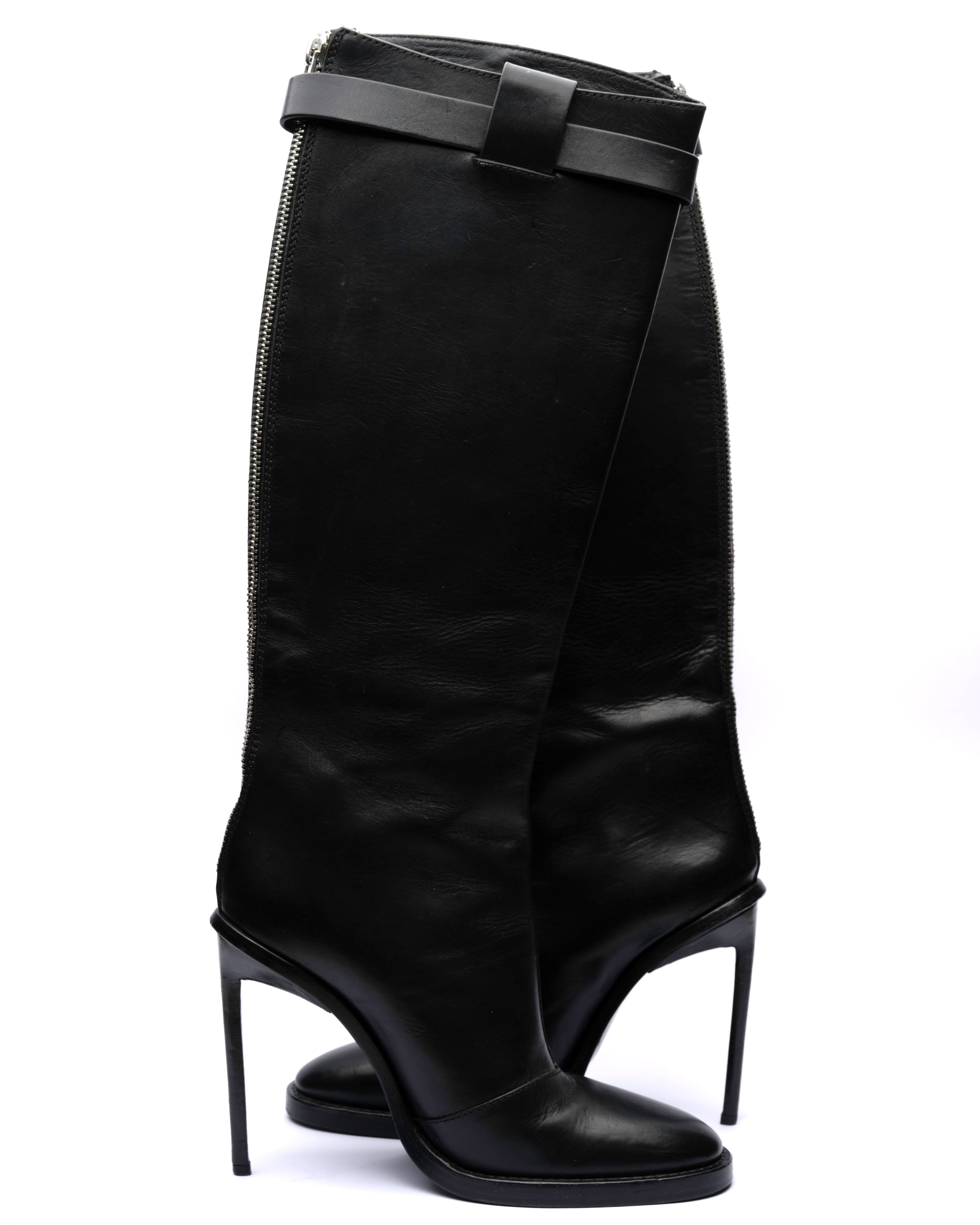 Black high-heeled knee-high boots with a bow detail on a white background