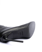 Black high-heeled shoes on a white background