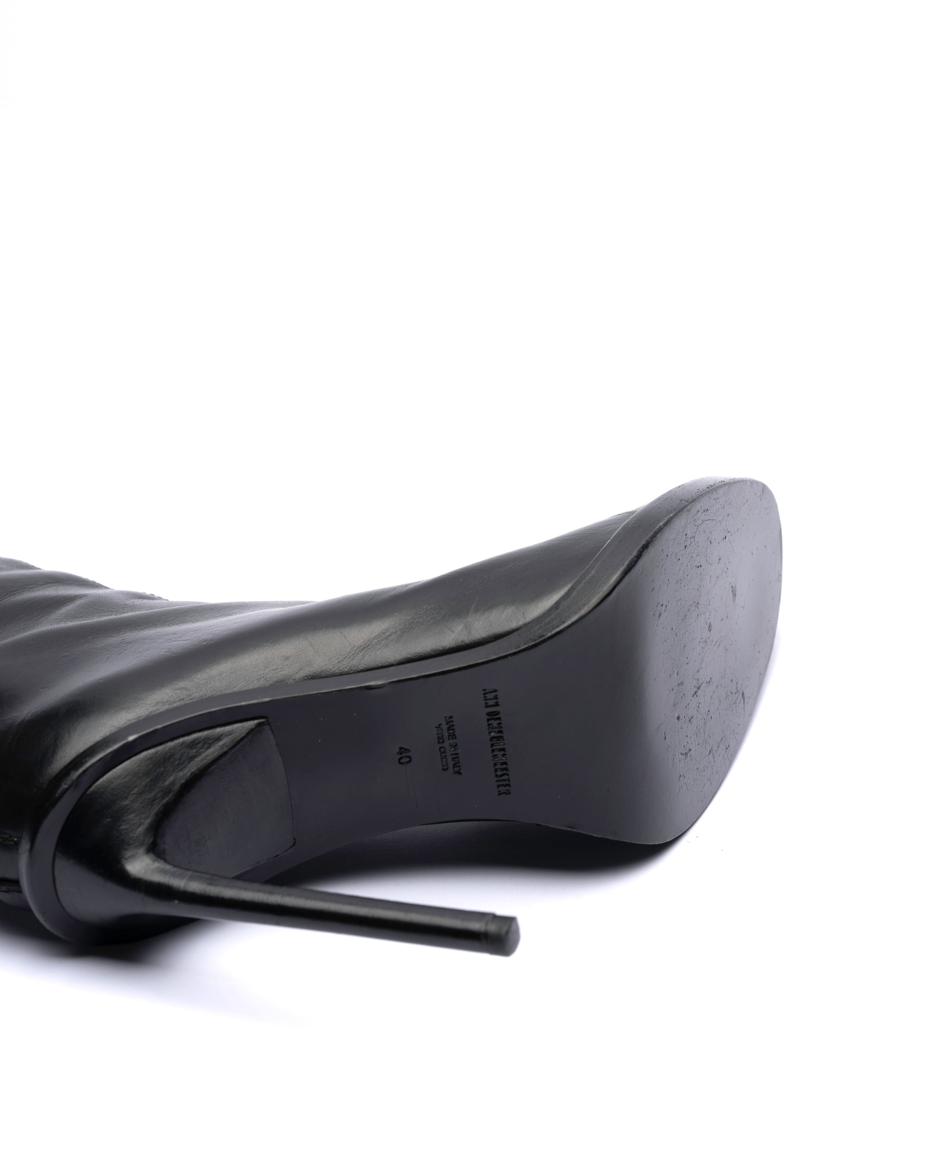 Black high-heeled shoes on a white background
